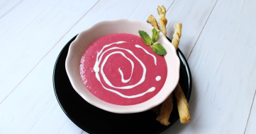 Cold raspberry soup with poppy seed oil and curled poppy seed strips