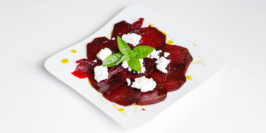 Light beetroot carpaccio with Pödör pistachio oil, blackcurrant balsamico and goat cheese