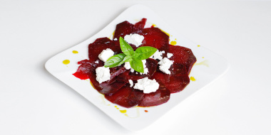 Light beetroot carpaccio with Pödör pistachio oil, blackcurrant balsamico and goat cheese