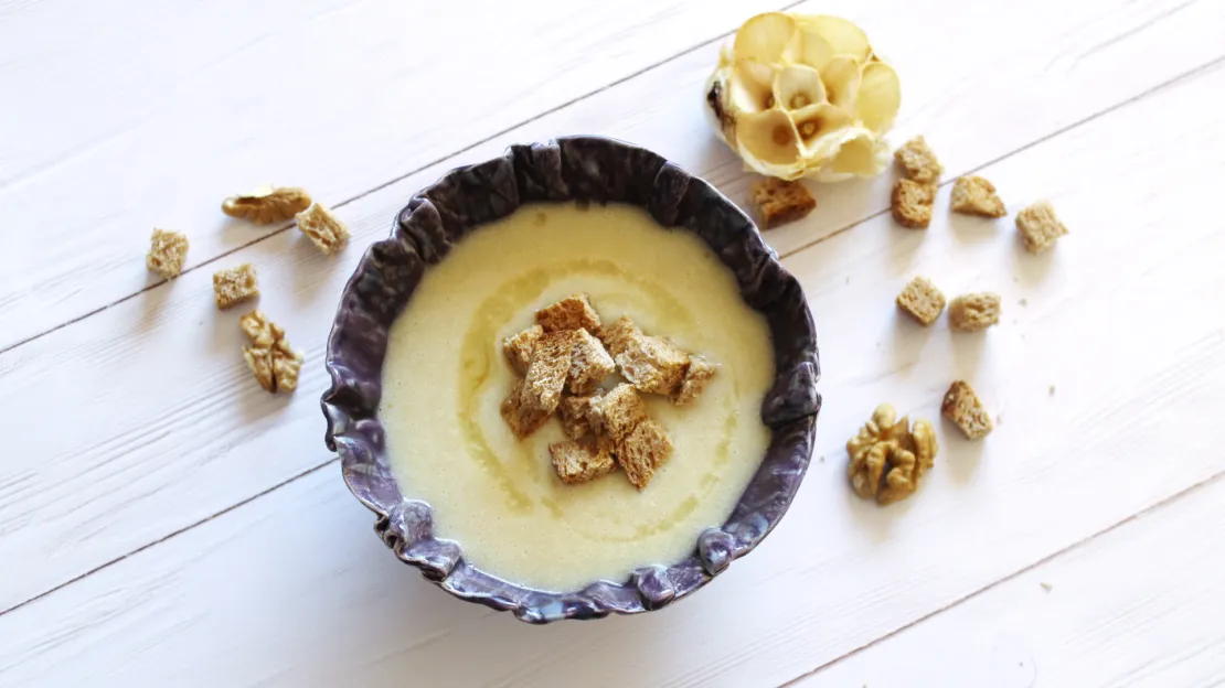 Garlic cream soup with walnut oil crouton